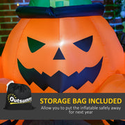 Outsunny drawstring storage bag beside the inflated pumpkin's carved face
