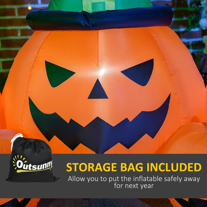 Outsunny drawstring storage bag beside the inflated pumpkin's carved face