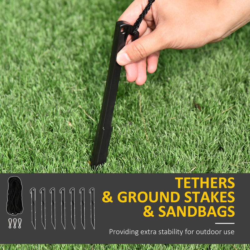 Hand pressing one of the 7 ground stakes into grass