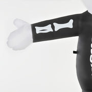 Detail of the inflatable arm with printed bone markings and white glove