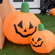 Close-up of the inflatable pumpkins at the base of the Halloween tree on grass