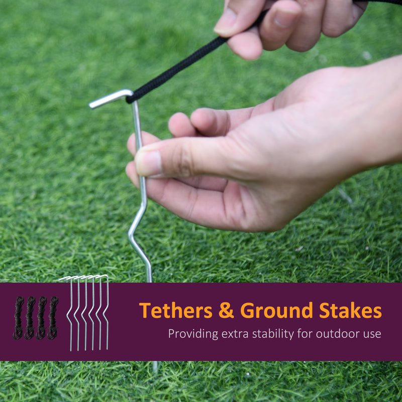 Hands fitting a ground stake into grass, with the 4 tethers and 6 stakes supplied
