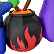 Close-up of the black cauldron with red flames and the witches' broom handles