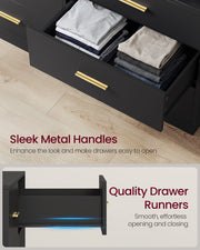 Open drawer of folded T-shirts and jeans beside a gold metal handle, with a drawer runner close-up