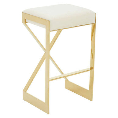 Three-quarter view of ivory velvet bar stool with gold cross-frame legs