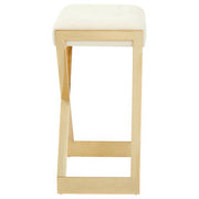 Side view of ivory velvet bar stool showing gold frame and lower foot rail