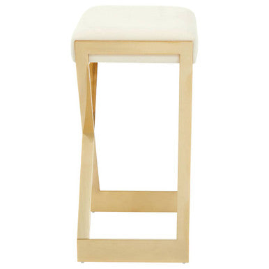 Side view of ivory velvet bar stool showing gold frame and lower foot rail