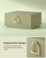 Closed light green jewellery box showing the gold handle and floating gold base detail