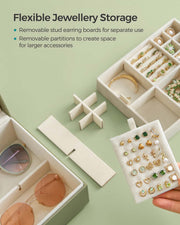Removable stud earring board and adjustable partitions being lifted out of the jewellery box tray