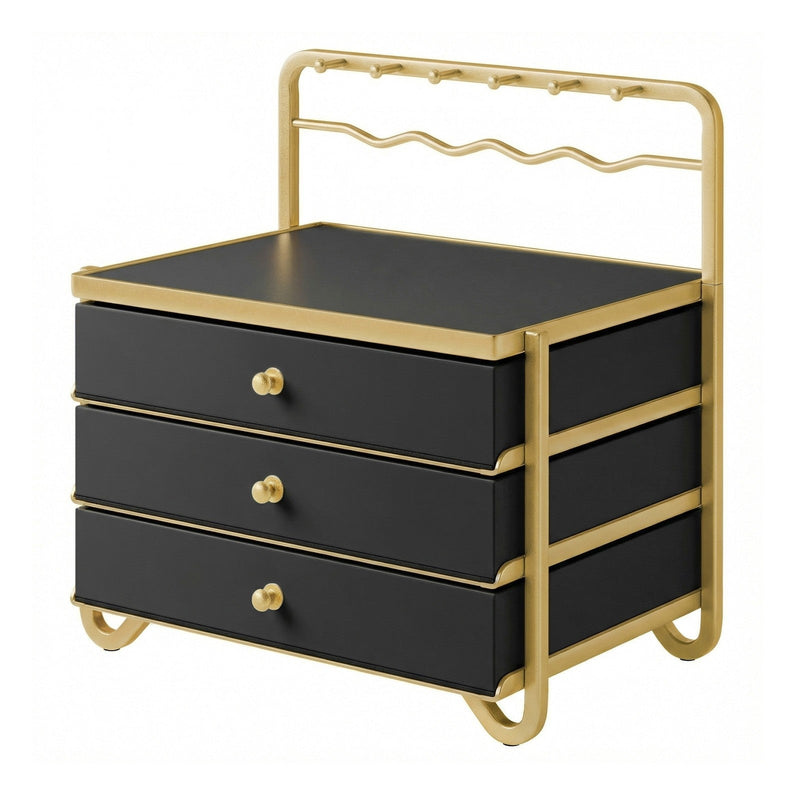 Ink black jewellery box with a gold metal frame and hanging rack, all 3 drawers closed