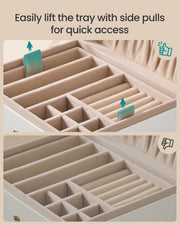 Close-up showing how to lift the jewellery tray using its side pulls for quick access