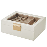 White and gold jewellery box with glass lid, closed, studio shot