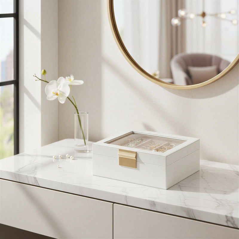 Jewellery box styled on a marble dressing table with a mirror and orchid