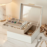 Jewellery box open showing the lifted tray, mirror in the lid and lower storage compartment