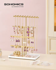 Close-up of the velvet tray holding rings and earrings