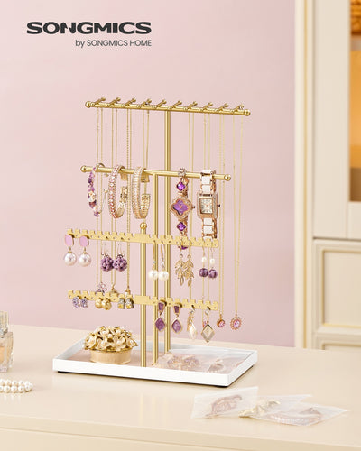 Close-up of the velvet tray holding rings and earrings