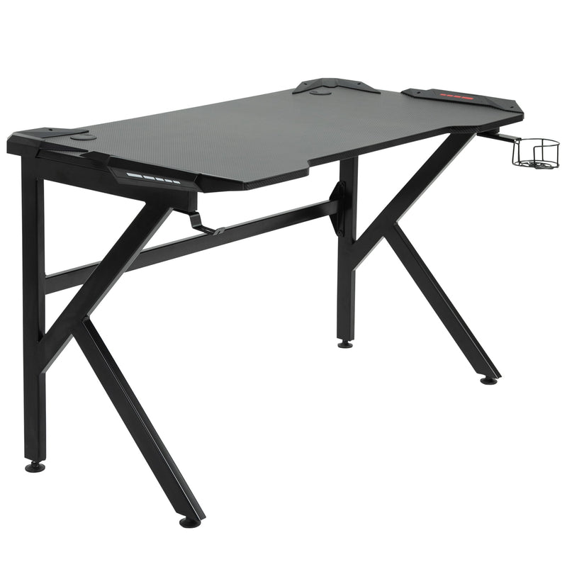 Black K-shaped gaming desk on a white background with the cup holder at the right end