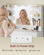 Close-up of the built-in power strip with 2 UK sockets, USB-A and USB-C ports