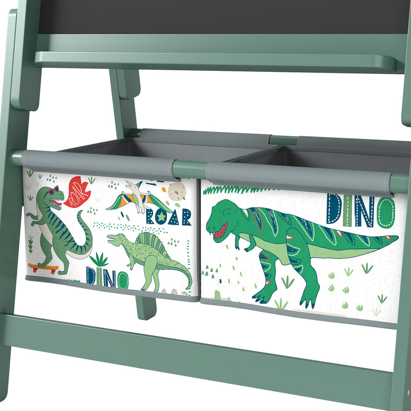 Close-up of the two dinosaur-print fabric storage bins on the green easel