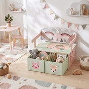 Pink toy box bench in a playroom with soft toys and blocks in the drawers