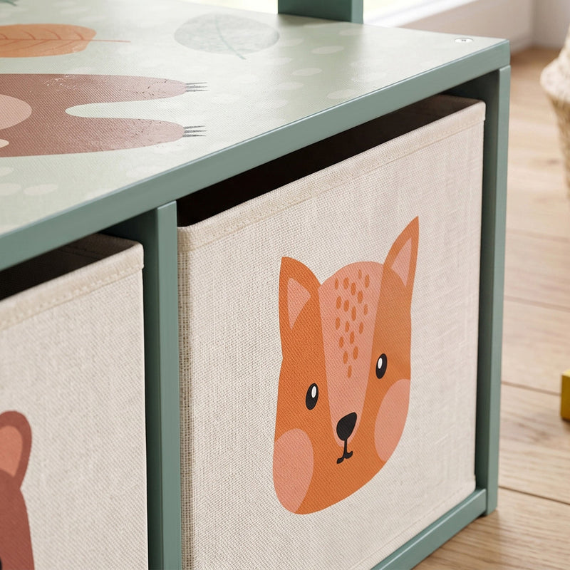 Close-up of the fox-print fabric drawer on the green bench