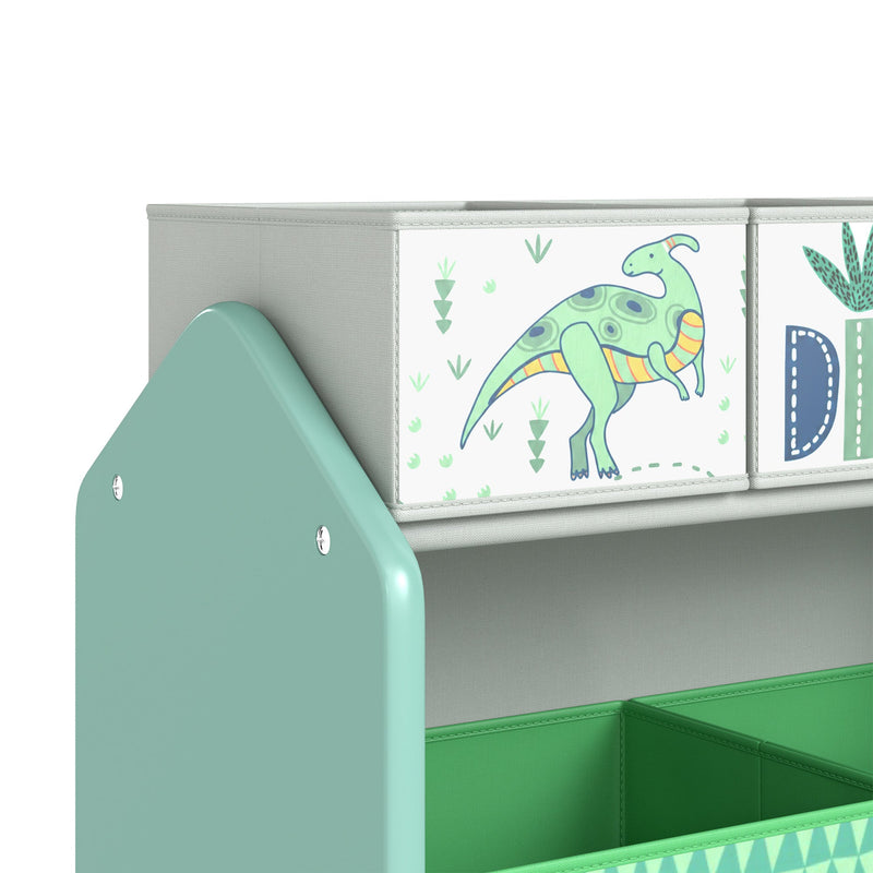 Close-up of the green toy rack top corner and dinosaur-print small bins