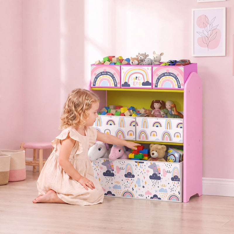 Girl sorting toys into the bins of the pink toy storage rack in a bedroom