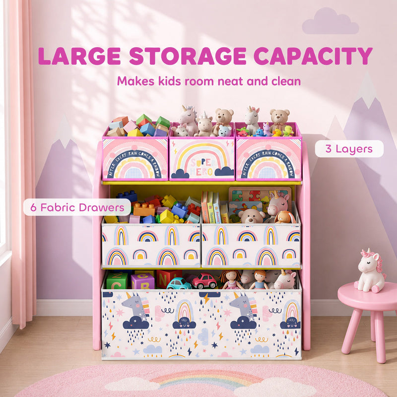 Pink toy rack labelled with 3 layers and 6 fabric drawers, full of toys