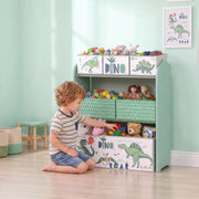 Boy sorting toys into the bins of the green toy storage rack in a bedroom