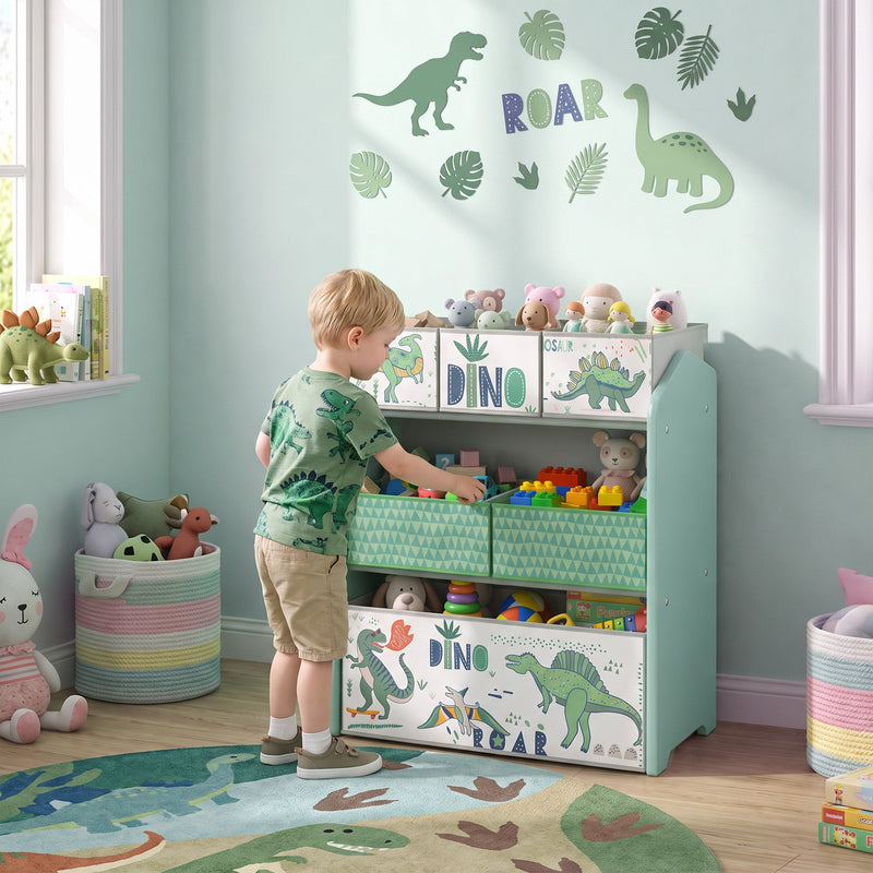 Boy tidying toys onto the green toy rack in a corner of a playroom