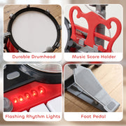 Cymbals and drum sticks included with the red drum kit