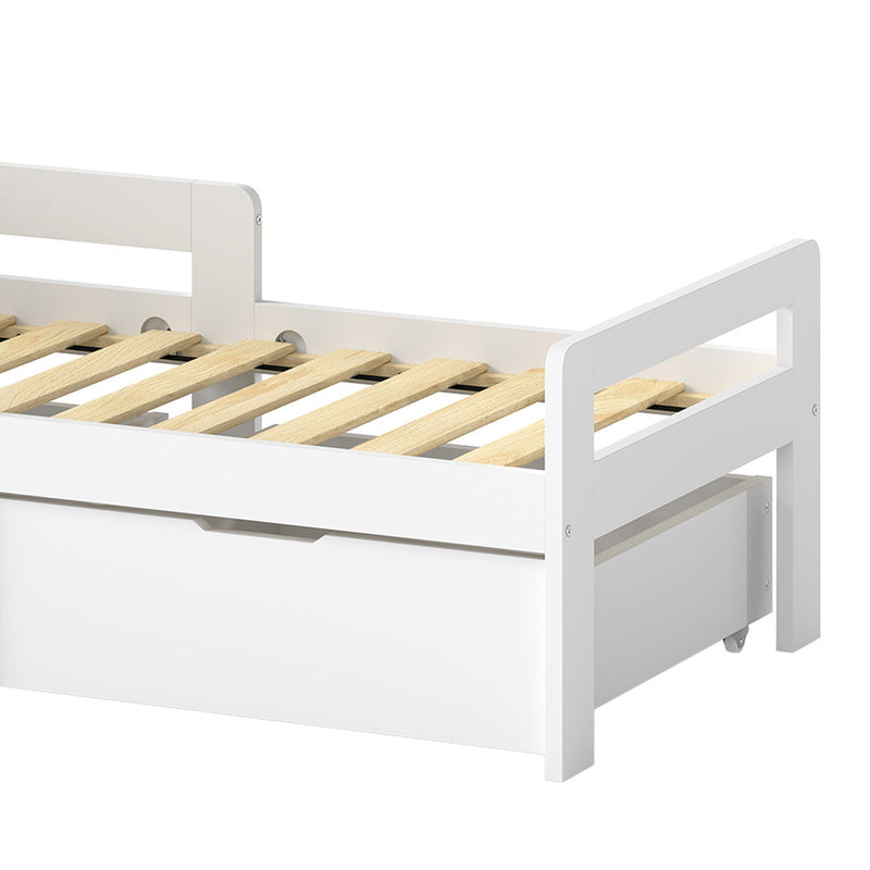 Close-up of the white kids bed slats, guard rail and storage drawer
