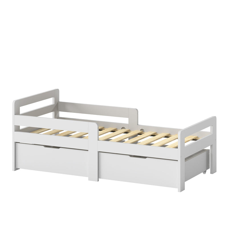 Grey kids bed frame with 2 storage drawers and guard rails on a plain background
