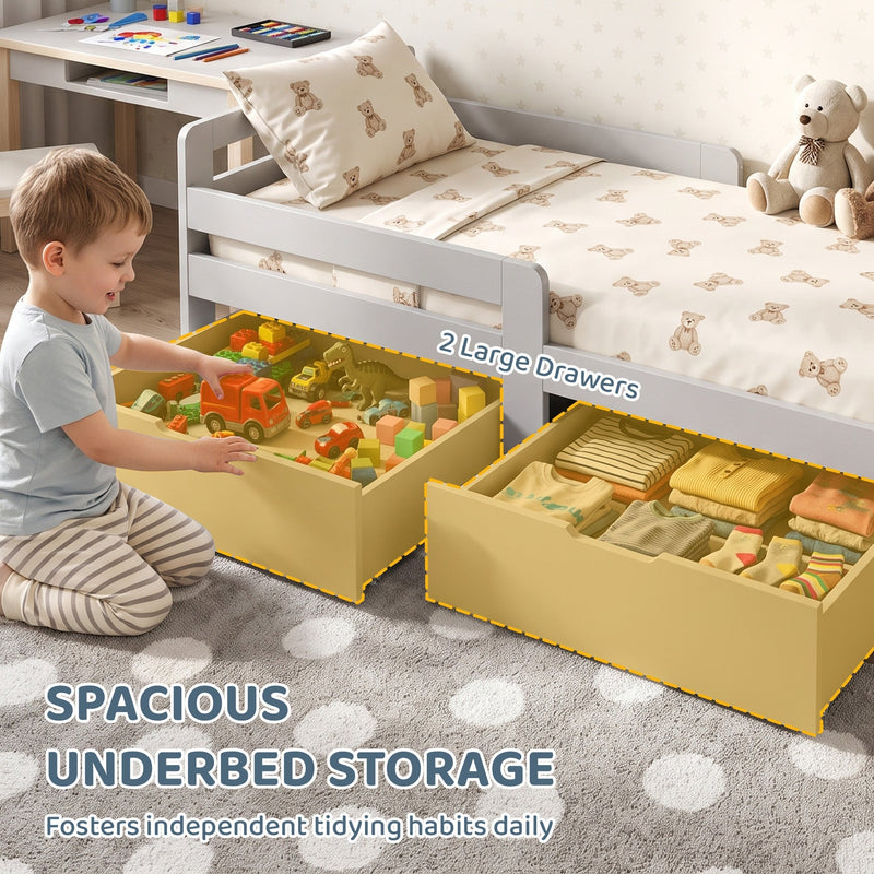 Child pulling toys from the 2 large under-bed drawers of the grey kids bed
