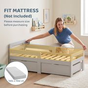 Parent fitting a 140 x 70 cm mattress onto the grey kids bed frame