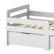 Close-up of the grey kids bed slats, guard rail and storage drawer