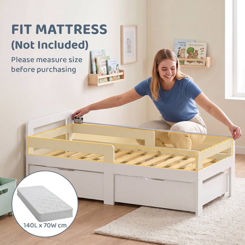 Parent fitting a 140 x 70 cm mattress onto the white kids bed frame