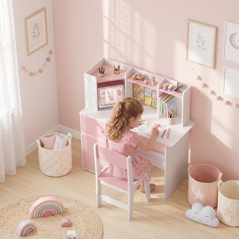 Girl drawing at the pink kids desk and chair set in a bedroom