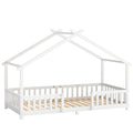 White wooden kids house bed frame with peaked roof and dual guardrails, studio shot