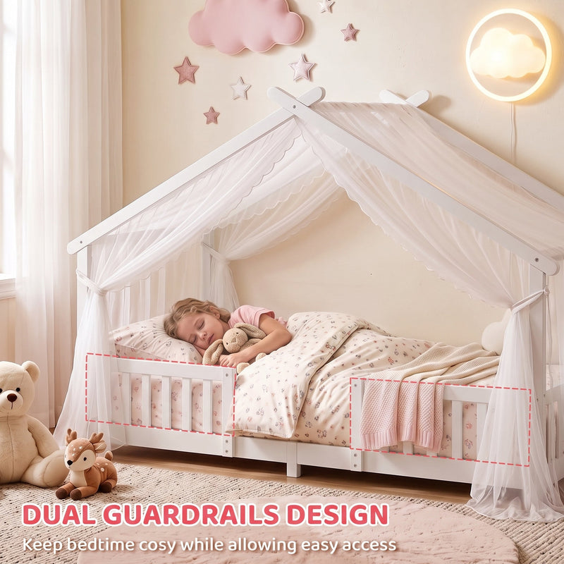 Dual guardrails highlighted on the white house bed frame with a sleeping child