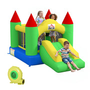 Children playing on the inflatable bouncy castle and slide with the blower in the corner