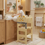 Toddler standing on the step stool at a bathroom sink with the cat design and chalkboard