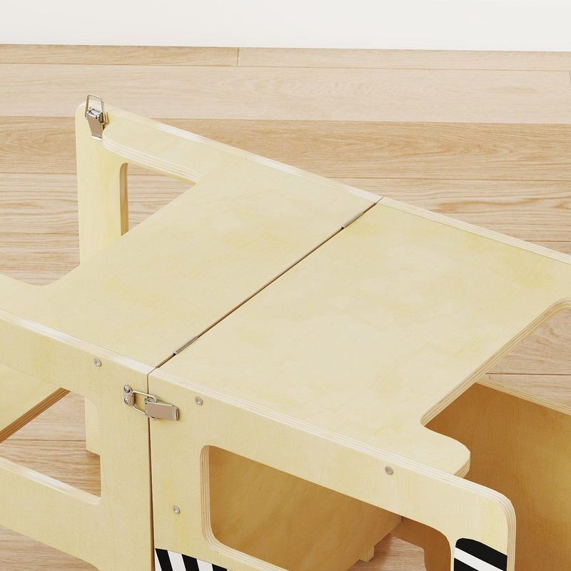 Close-up of the fold-out desk surface and locking clip mechanism