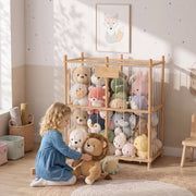 Child sitting beside the wooden storage frame filled with soft toys
