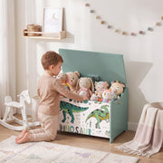 Child putting soft toys into the green dinosaur toy chest in a bedroom