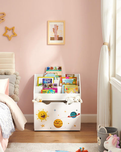 Toy organiser filled with books standing beside a bed in a pink child's bedroom