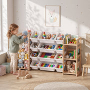Child placing a stuffed toy into the plush toy basket of the wooden toy storage unit