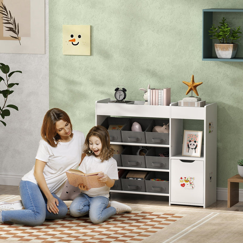 Mother and daughter sharing a book on a checked rug beside the toy storage unit