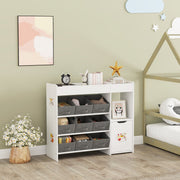 Toy storage unit next to a house-frame bed, topped with an alarm clock, books and a star