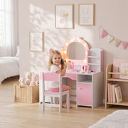 Girl brushing her hair at the pink kids vanity set